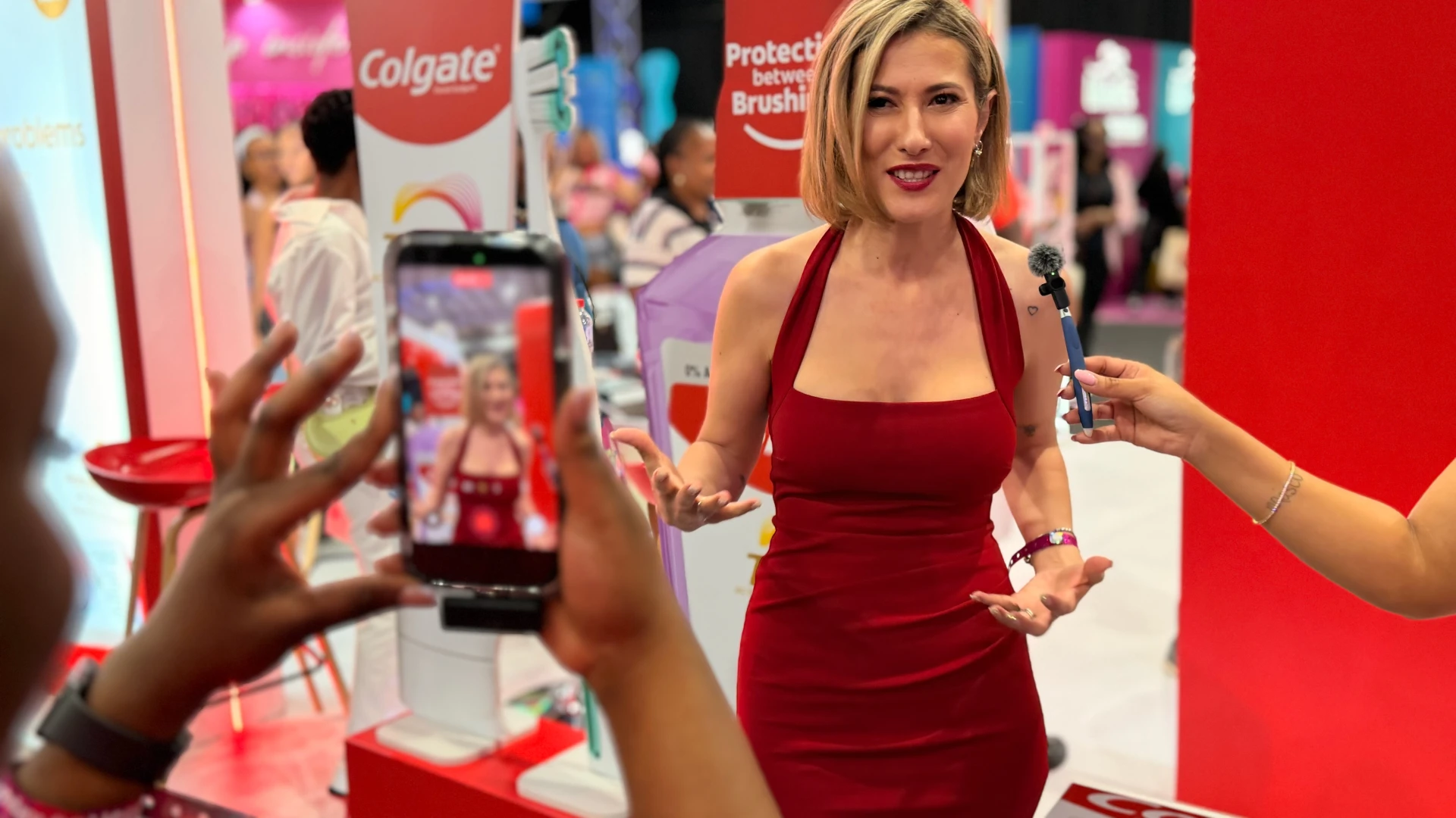 Danielle Steynvaardt being filmed for social media at a Colgate brand activation