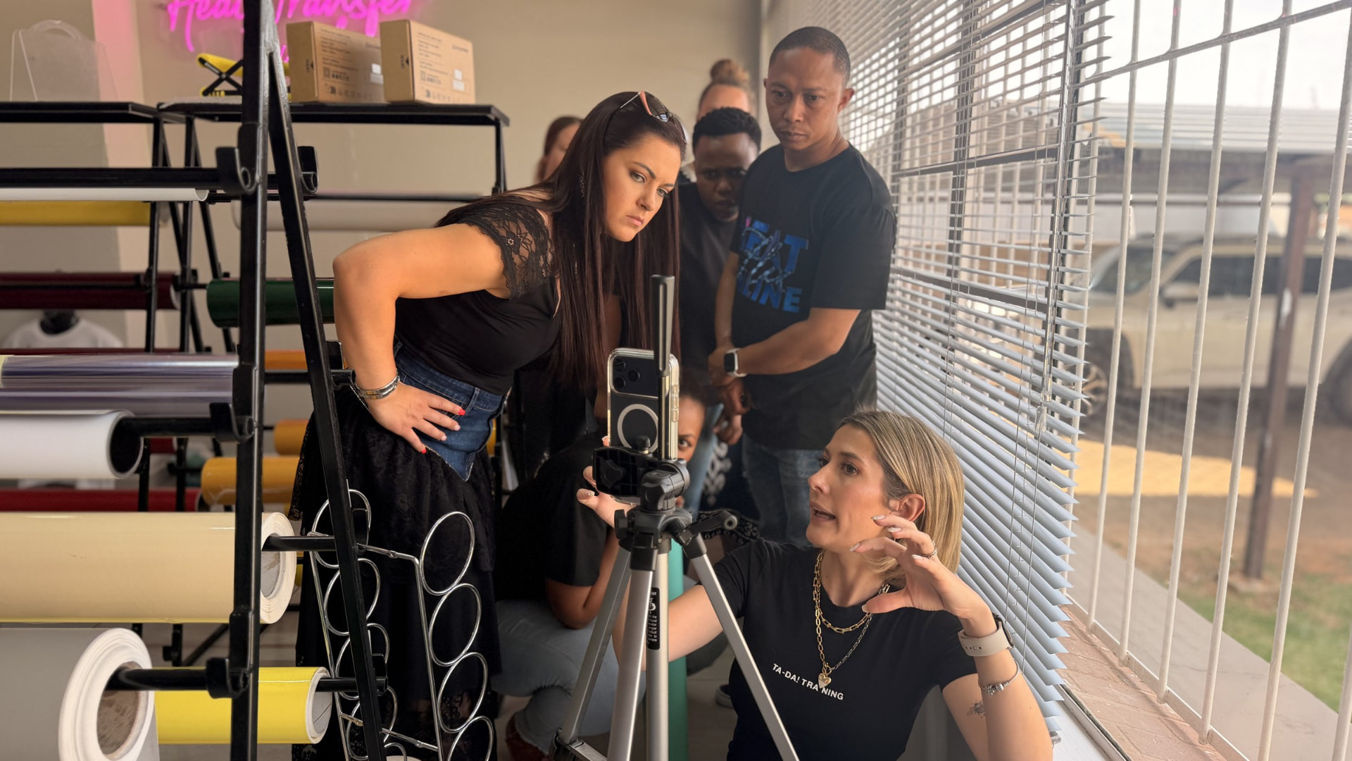 Danielle Steynvaardt training a business team to film their own content in their workplace